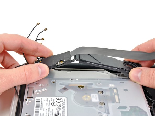 Image 1/2: Remove the AirPort/Bluetooth board assembly.