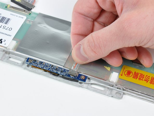 Disconnect the iSight cable from the top of the display.