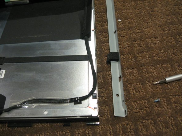 Image 2/3: Use a T10 Torx driver to remove the 2 screws from each side bracket (total 4 screws)