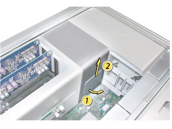 Image 2/3: With your fingers still under the cover’s bottom lip, lift the cover straight up to release the remaining tabs and magnets under the front face of the cover