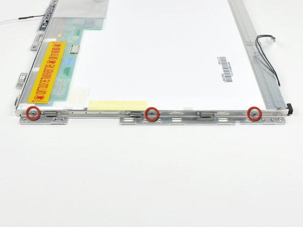 Remove the three 3.1 mm Phillips screws along the left edge of the display.