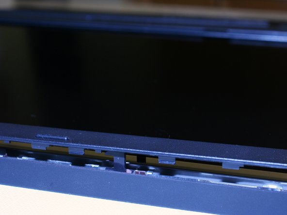 Image 2/3: If everything looks ok then remove the battery and put the screws in. Remove the protective sheet from the display and put the bezel back on.