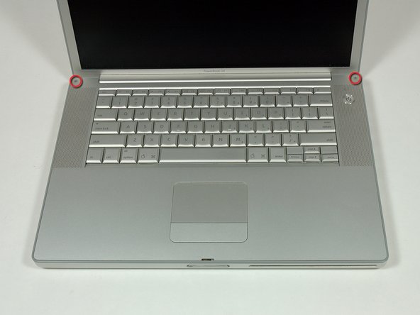 Image 1/1: Remove the two 4.2 mm long, 1.5 mm hex screws at the top corners of the upper case (two total).