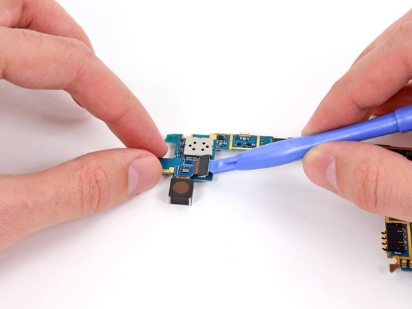 Image 2/2: Use a plastic opening tool to pry the rear-facing camera connector from its socket.