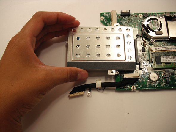 Pull the hard drive straight out from the motherboard.