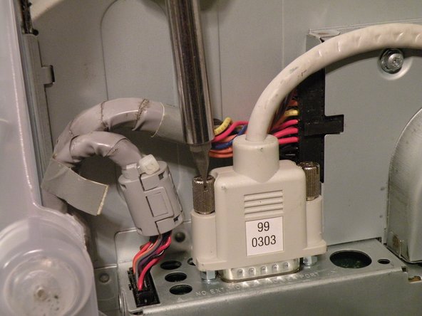 Image 2/3: It may be helpful to use a Phillips screwdriver to remove the thumbscrews.