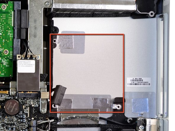 Image 1/1: The drive will sit behind the optical drive in the space highlighted in red.