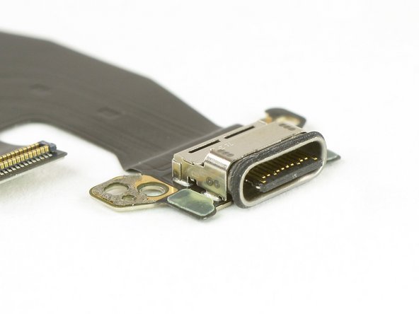 To our surprise, we get not only the flex cable but the complete daughterboard as well. It's glued to the USB-C port, which is equipped with an IP67-approved rubber gasket.