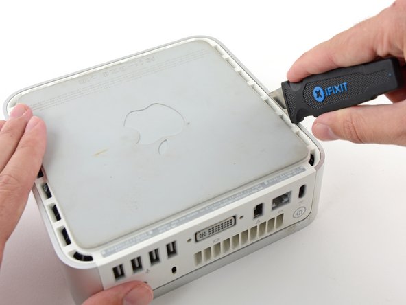 Gently bend the Jimmy outwards to pry the crack open a little larger and lift the lower housing up a small amount.