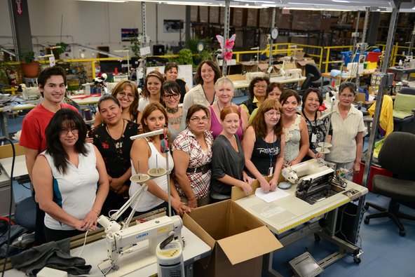 Delia the repair champion, with her team at the Patagonia warehouse