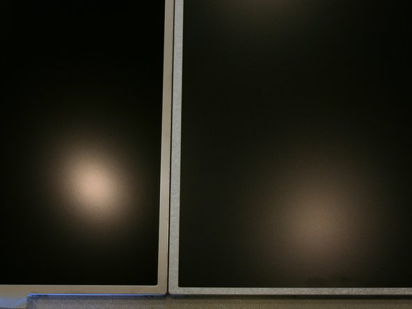 Image 1/1: The V.4 is slightly more reflective than the basic T520 display. The B156HW01 V.4 on the left makes a more focused reflection of the overhead light while the stock display (LG LP156WH4) creates a larger diffused reflection.