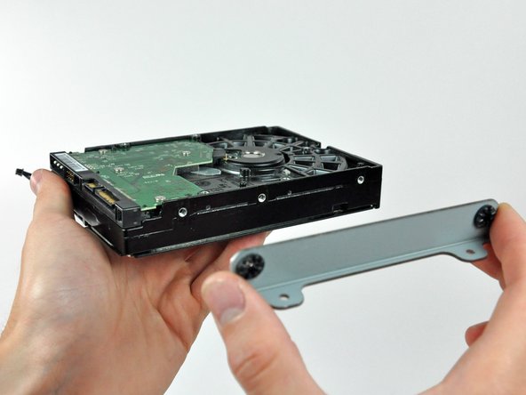 Image 2/2: Remove the hard drive bracket.
