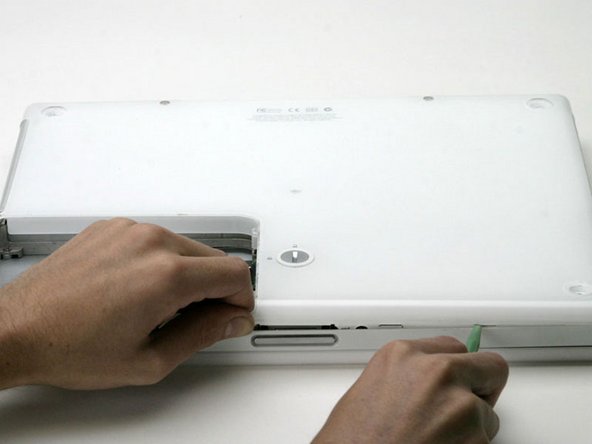 Image 1/1: Pull up on the lower case and continue to use the spudger as necessary until you hear three distinct clicks.