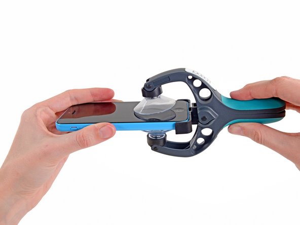 Image 2/3: Place the bottom of your iPhone in between the suction cups, against the plastic depth gauge.