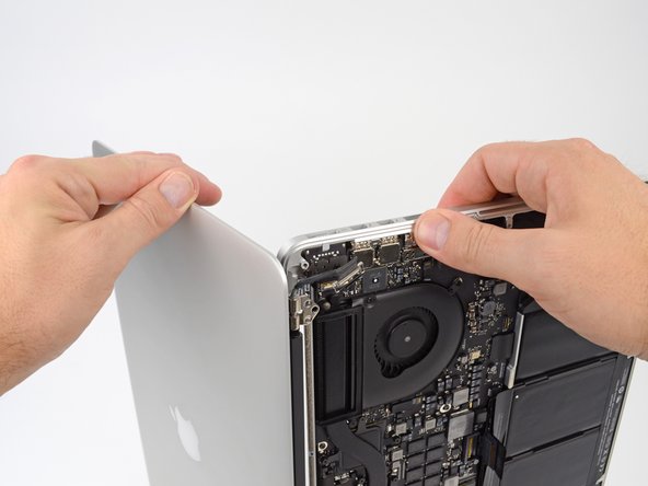 Image 2/3: Carefully set each component aside, making sure to set down the lower half keyboard-side down.