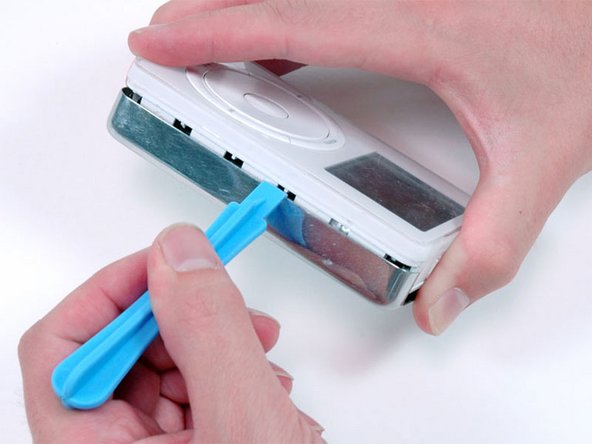 Image 1/1: Lift the rear panel away from the iPod.