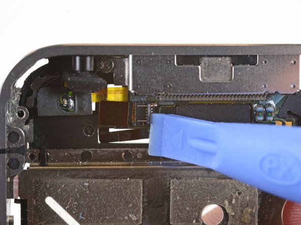 Image 3/3: Be sure you are prying up on the cable retainer, '''not''' the socket itself.