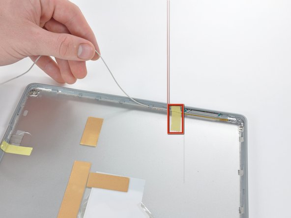 Image 1/1: De-route the antenna cable from the left side of the read display bezel.