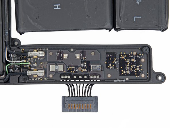 Image 3/3: It's certainly nice to see a more conventional battery connector, rather than the earlier revision's [guide|11225|contact board shenanigans|stepid=40188]. [http://knowyourmeme.com/memes/%E1%83%9A%E0%B2%A0%E7%9B%8A%E0%B2%A0%E1%83%9A-but-at-what-cost|But at what cost], Apple?