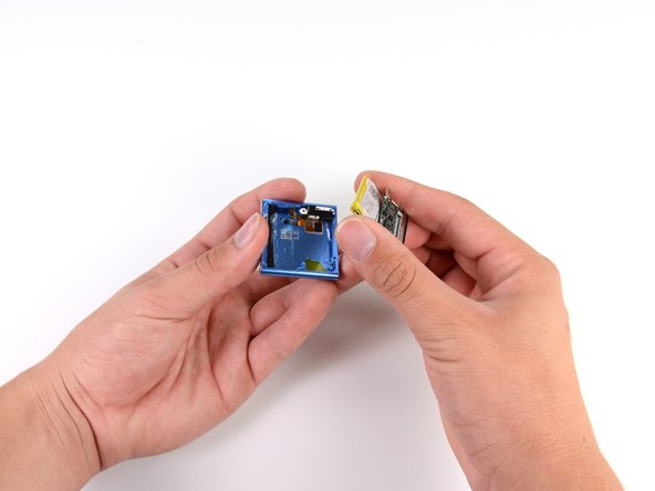 With a little wiggling, the battery and logic board come free, though soldered together.