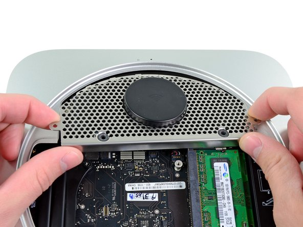 Image 2/2: Do not remove the antenna plate yet. It is still attached to the AirPort/ Bluetooth board.