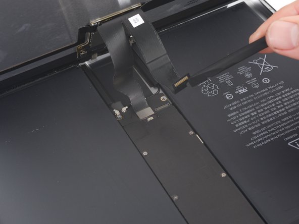 Use the flat end of a spudger to disconnect the two display data and digitizer cables from their respective sockets on the motherboard.