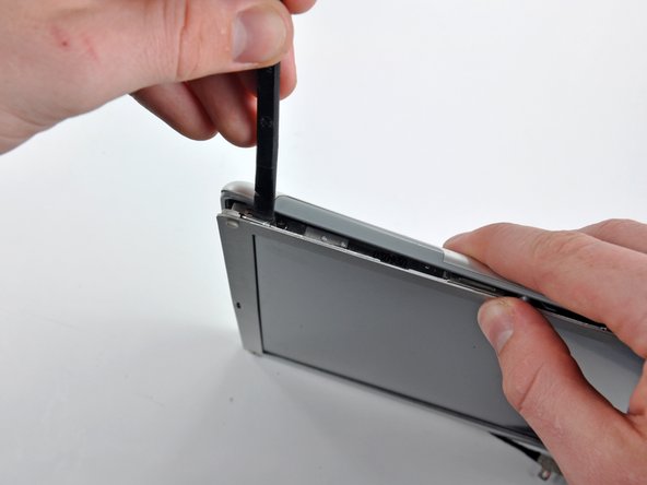 Image 2/2: Repeat this process on the top right corner of the display.