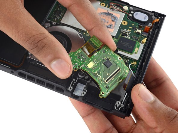 Image 2/3: We aim for the fan, but looks like you can only clean it from here—it's trapped under the I/O board.