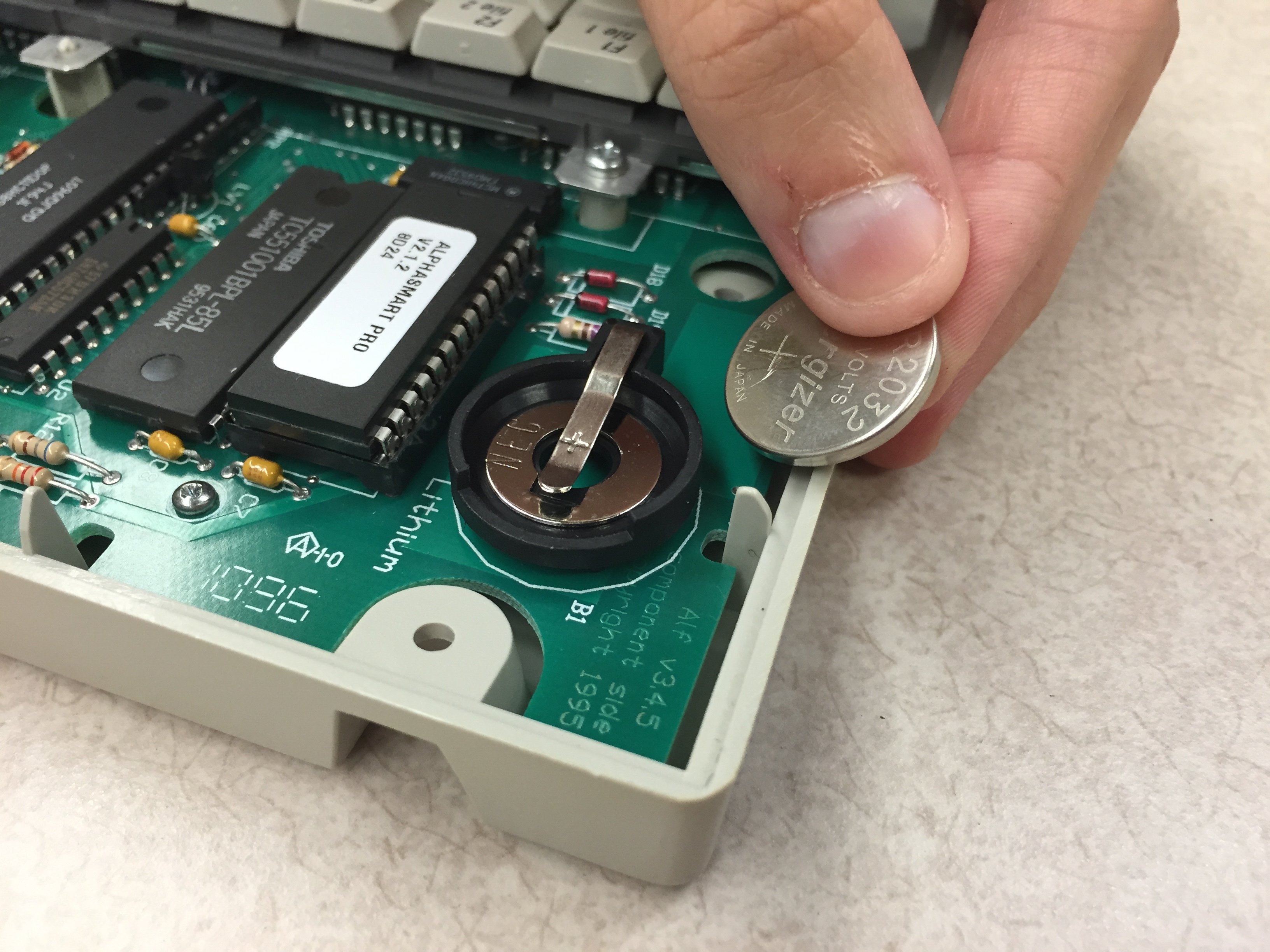 AlphaSmart Pro Lithium Coin Battery Replacement iFixit Repair Guide