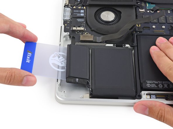 Image 2/3: If you encounter significant resistance, stop and use the iOpener to re-heat the battery cells.