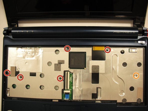 Remove the five black 4.7 mm Phillips #0 screws from the metal casing.