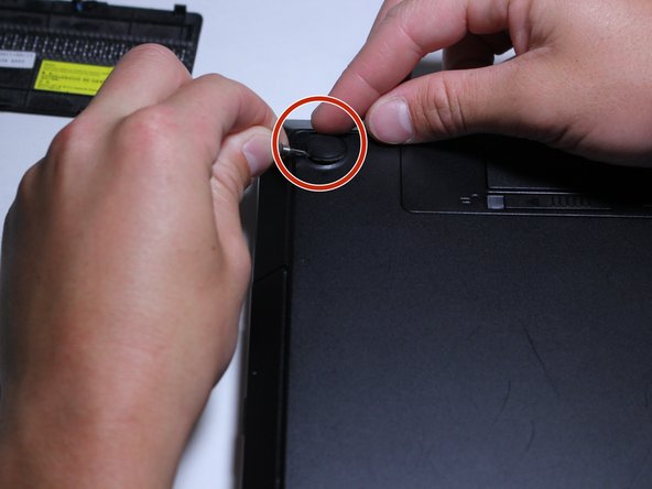 Remove the rubber pads on the remaining 3 corners of the computer.