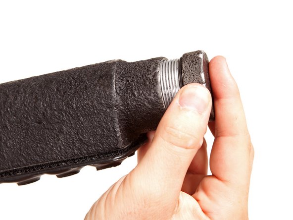 Image 1/3: Wondering what kind of technology keeps the tracking device powered? Let's remove the battery pack's end cap and find out.