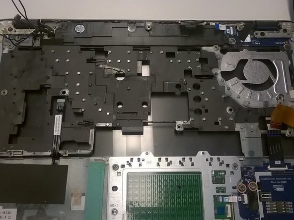 Image 1/1: The power board in the top left is also removable, but normally doesn't need replacement, and the two hinges can be loosened to pull the LCD assembly off of this top cover.