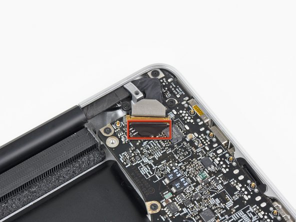 Image 1/3: Pull the display data cable out of its socket.