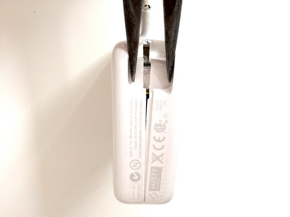 Image 1/2: Be careful, as this step can potentially do the most damage to the outer casing. Take your time, and wrap the plier tips with some tape if you don't want to leave any marks.