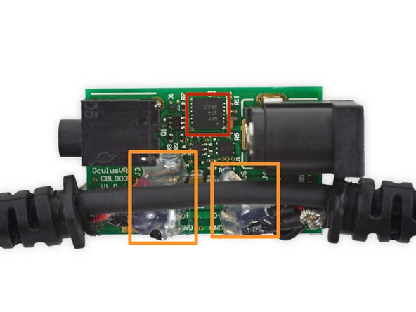 Image 2/3: You can sleep soundly knowing that those cables aren't going anywhere, because Oculus didn't skimp on the globs of hot glue on the inside of the cable hub.