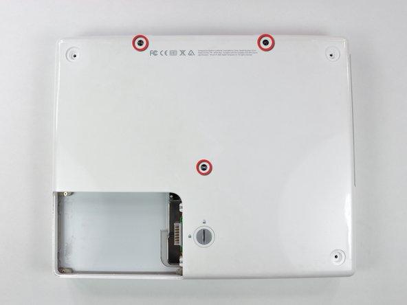 Image 1/1: The shorter screw is in the center of the computer.