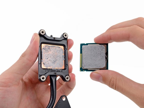 Image 2/3: The new iMac uses a spring-loaded, [http://en.wikipedia.org/wiki/LGA_1155|FCLGA1155] socket to make all those little electrical signals go into, and out of, the CPU.