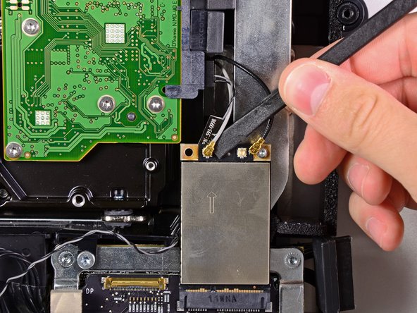 Image 2/2: The gray antenna attaches to the socket on the left and the black antenna attaches to the socket on the right.