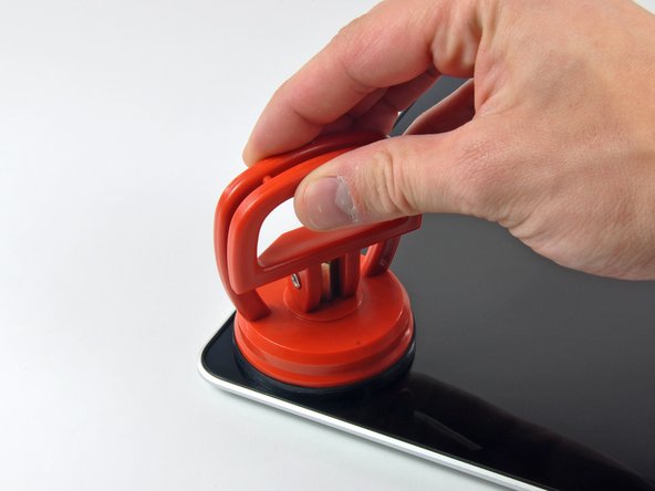 Image 2/3: To attach the [product|IF145-023|suction cups] we sell, first position the suction cup with the movable handle parallel to the face of the glass panel. While lightly holding the suction cup against the glass, raise the movable handle until it is parallel with the other handle.