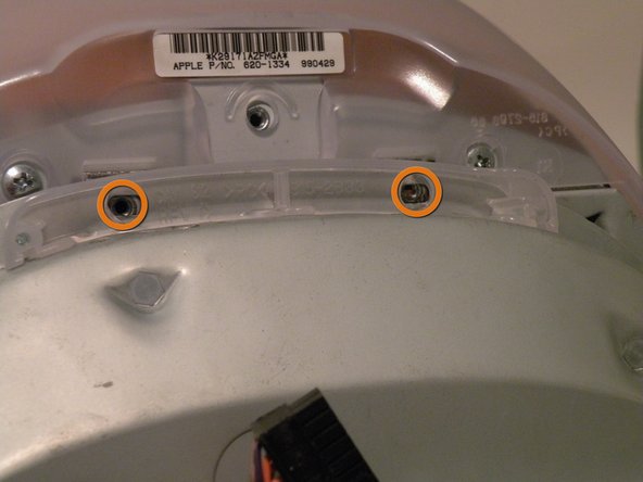 Image 1/3: Now, grab the logic board assembly by the piece of plastic, and lift it out.