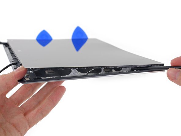 Step 2: Pry gently in many places. Opening Picks are the ideal tool.