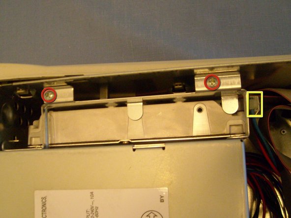 Image 1/2: Remove the two phillips screws