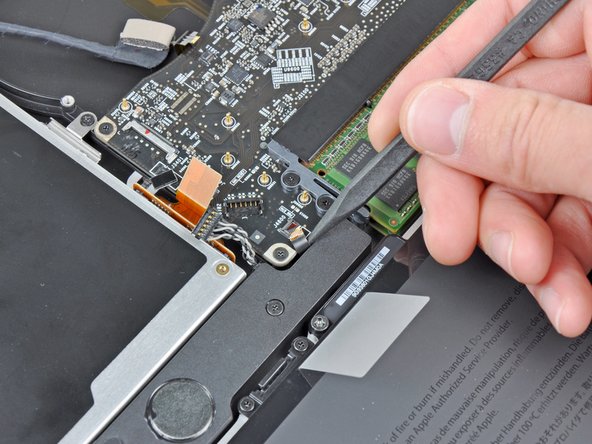 Image 2/2: Pull the IR sensor ribbon cable out of its socket.