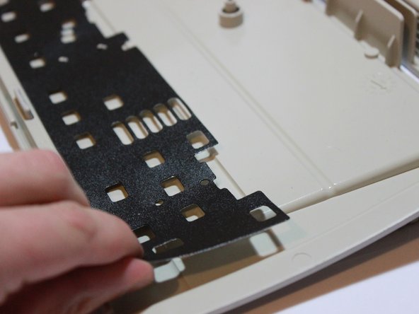 Image 3/3: This is easiest to do if you start from one side, apply downward pressure, and continue to each subsequent set of clips.