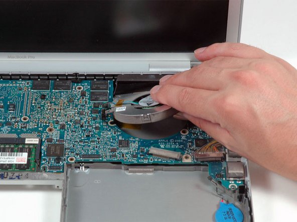 Image 1/1: Remove the right fan from the computer.