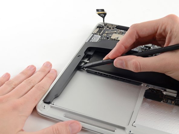 Image 1/3: Remove the right speaker from the upper case.