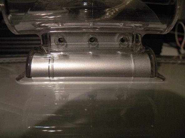 Image 3/3: Then remove the swing arm, and the piece of plastic underneath it.