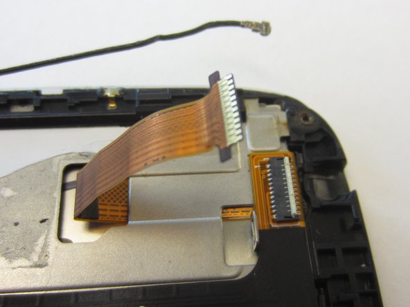 Disconnect gold ribbon cable connecting screen to logic board by pulling cable out gently.